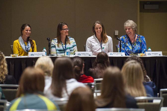Women in Sports panelists Sharon Rissmiller (from left), Heather Tracy, Monica Barnhart and Julie Heisey discuss their career paths with attendees in the coaching panelist session.